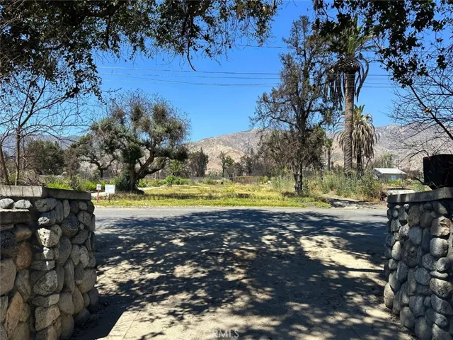 River Rock wall with gated entry/exit
