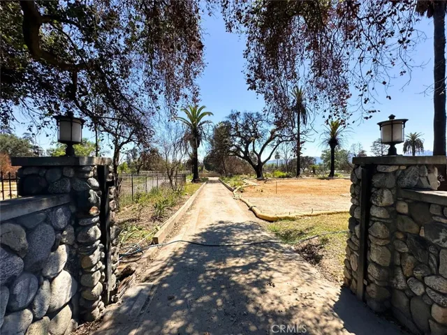 Long paved driveway for separate entrances