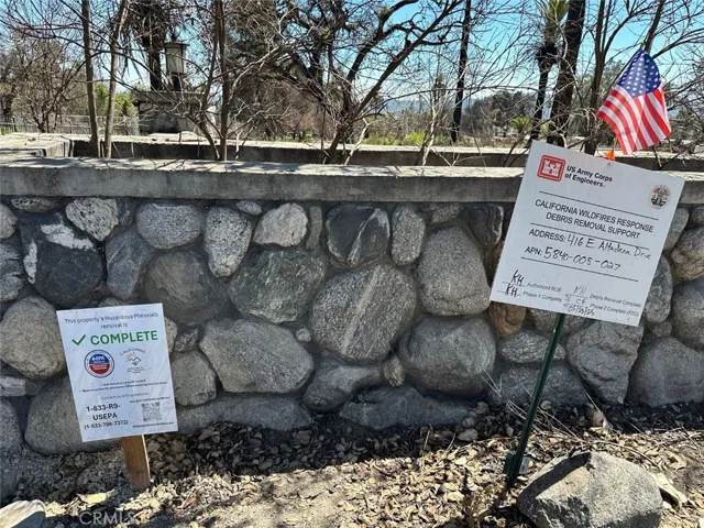 Phase 1 & 2 done. 90' river rock wall with gated entry