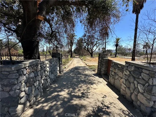 Gated entrance with long driveway