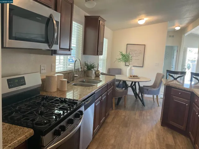 Gas range kitchen toward eating area