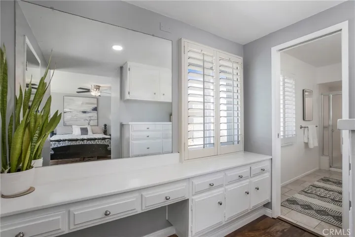 Primary bath vanity and built in dresser