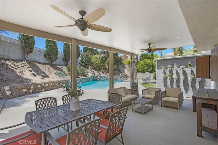 Insulated outdoor room with ceiling fan, herb garden and outdoor entertainment center