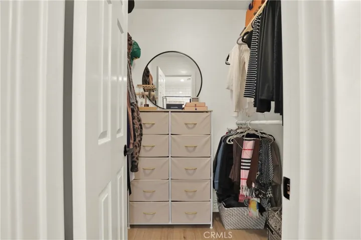 Primary bedroom walk in closet