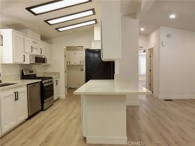 Kitchen with Quartz Peninsula with Bar Seating