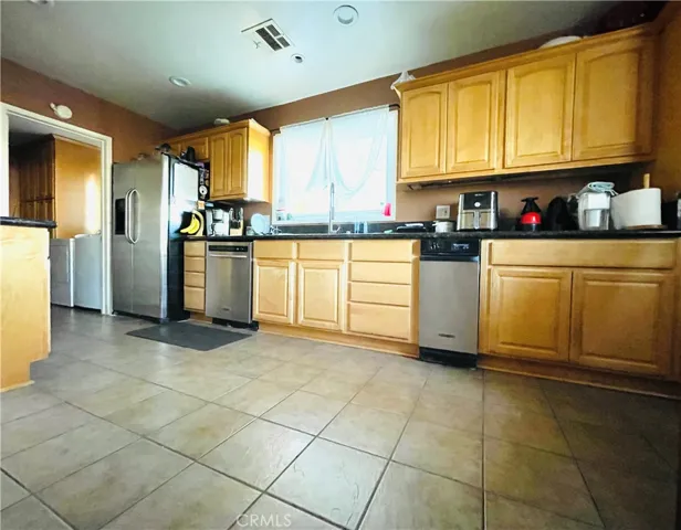 Updated Kitchen. Wood Cabinets and Granite Countertops.