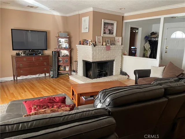 Large Living Room with Fireplace. Approximately 20’ by 15’ 3”