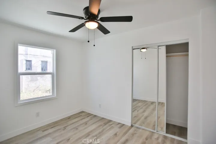 Bedrooms with new flooring and ceiling fans