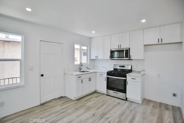 New kitchen appliances, cabinets and flooring