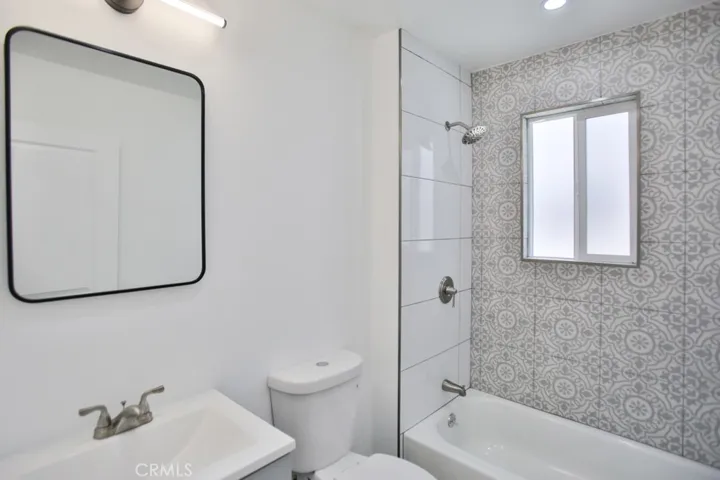 new bathroom with designer tiles