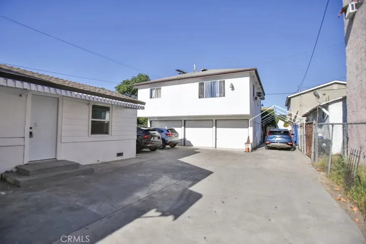 Driveway leading to the 3 car garage and back unit