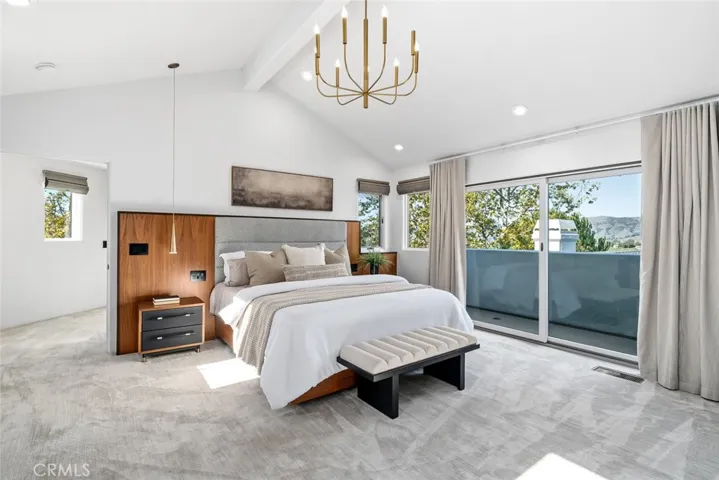 Primary Bedroom features a custom built in Headboard.