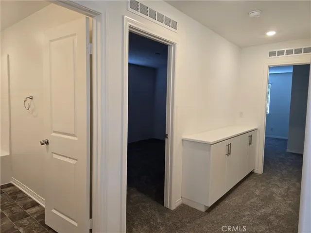 Hall view looking at Hall Bath and 2 Secondary Bedrooms