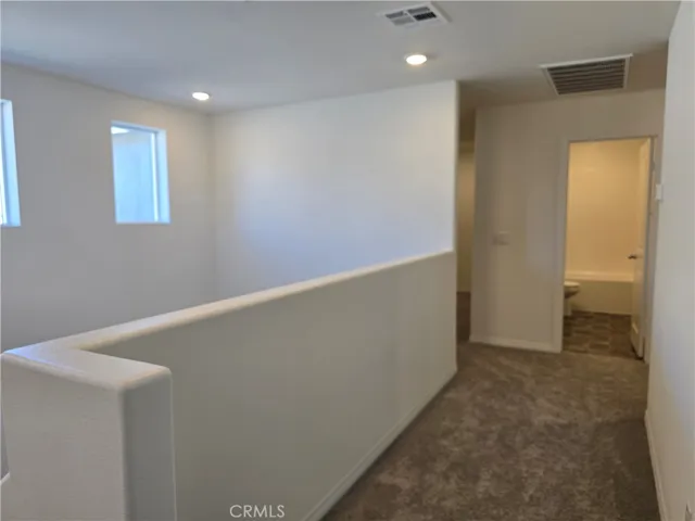 Hallway from Primary to Secondary Bedrooms & Bonus Room