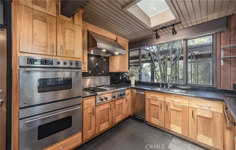 KITCHEN WINDOWS OVERLOOK FRONT PORCH ENTRY