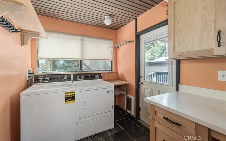 INTERIOR LAUNDRY ROOM WITH COUNTER AND CABINETS