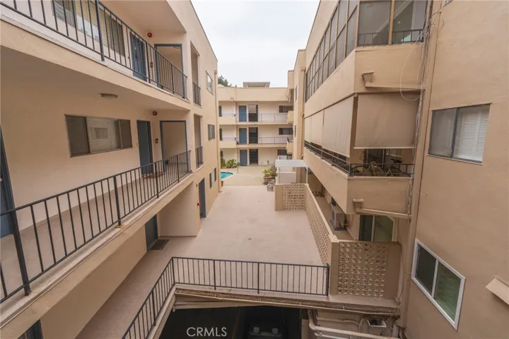 view from the exterior hallway by the front door of the unit