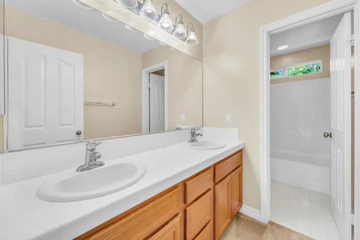 Upstairs Hallway bathroom with double vanity