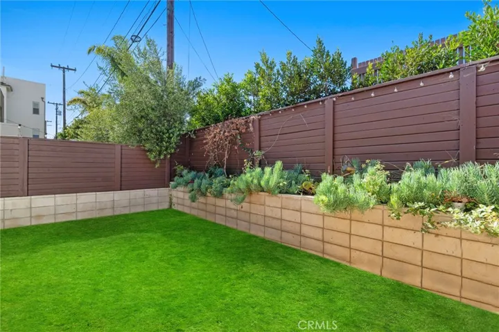 Private yard located directly next to the kitchen (grass has been virtually added)