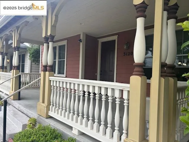 View of exterior entry with a porch