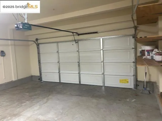 Garage featuring a garage door opener