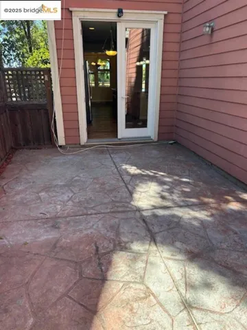 View of exterior entry featuring a patio area
