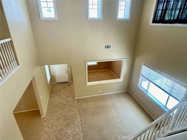 Stunning home with Cathedral-ceiling Main floor formal living, home office/library and a spacious bedroom with a full bath.