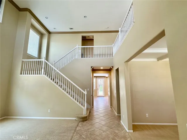Through the high-ceiling entry to this stunning home