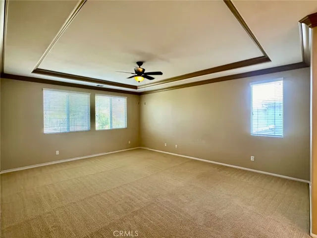 Spacious Master Suite with Trey Ceiling, Dual Vanities, Shower, Tub, and a Large Walk-in Closet