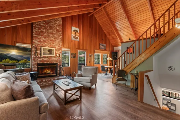 High beamed ceilings and grand fireplace