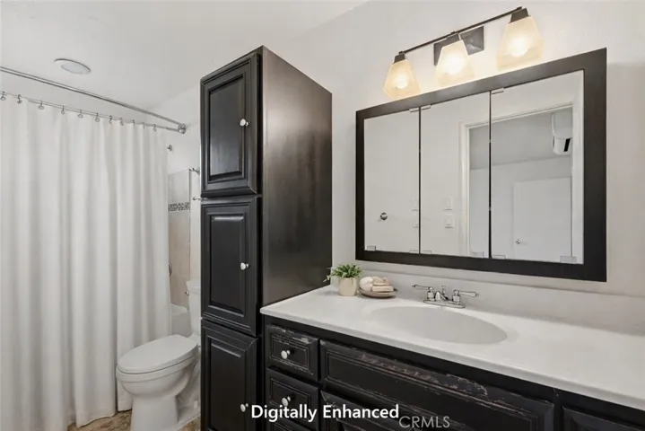 Digitally staged primary suite bathroom