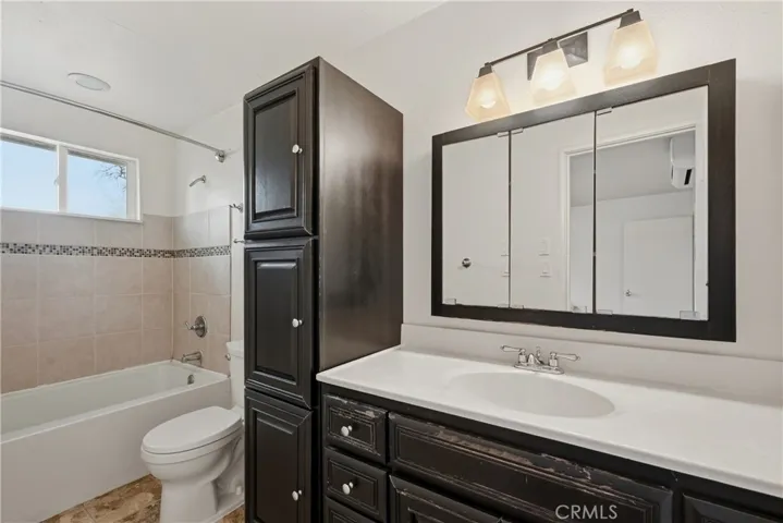 Primary suite's bathroom has plenty of storage