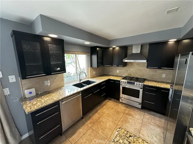 Kitchen with all stainless-steel appliances included and easy closing drawers.