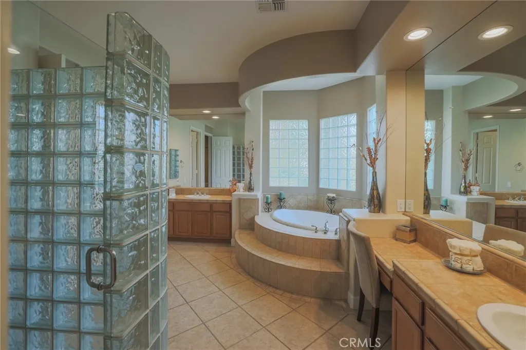 Primary bedroom bath with soking tub and shower