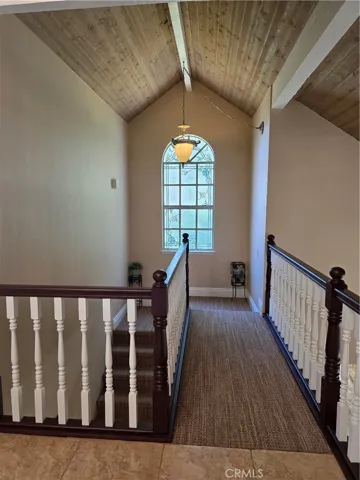 Stained glass window at top of the stairs