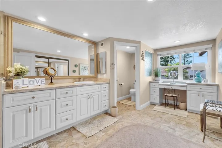 Her primary bathroom with vanity