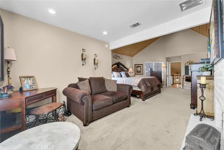 Primary suite/sitting room off bedroom with fireplace