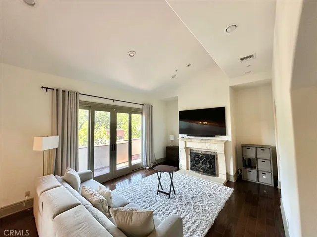 high ceilings and spacious living room with fireplace