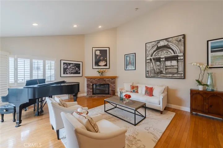 Living room with vaulted ceilings & fireplace