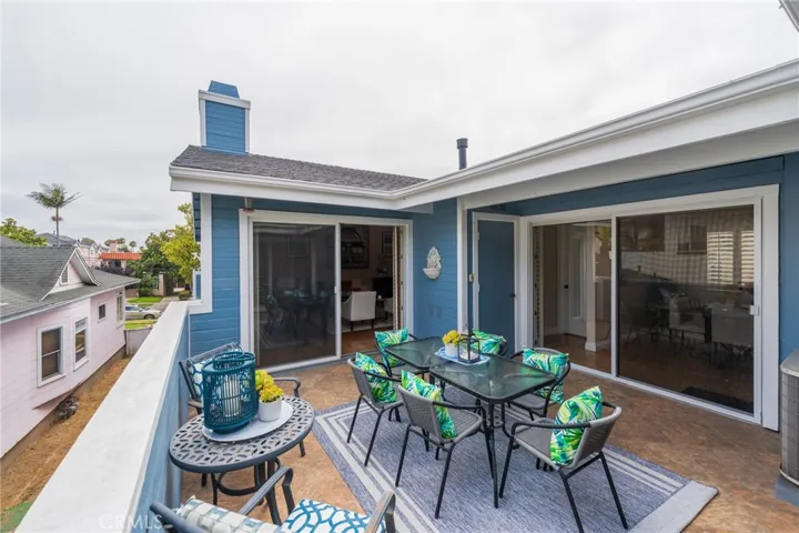 Upper level patio open to the living, dining and family rooms