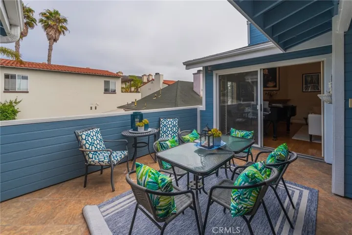Sunny patio anchors the upper level living, dining & family rooms