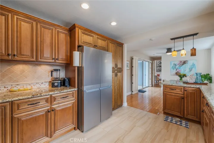 Warm wood cabinets & Stainless appliances