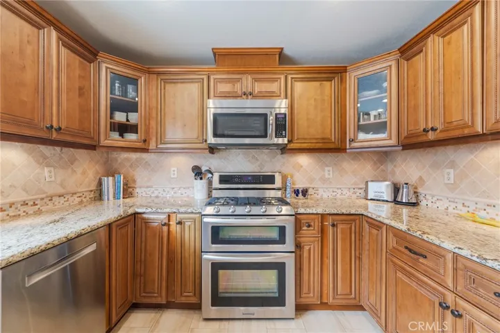 Two ovens, gas cooktop and microwave.