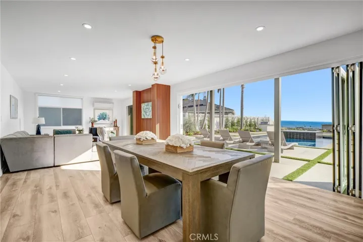 Main floor Dining & family rooms open to outdoors with 2 sets of large sliding doors.