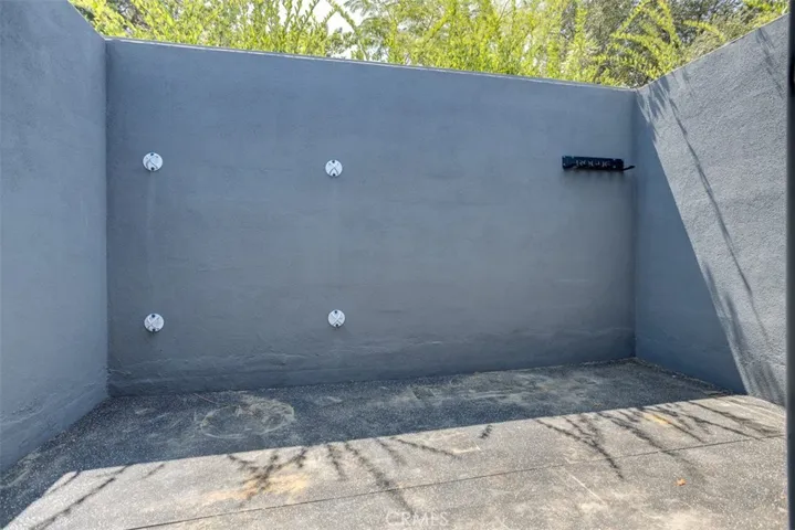 walled area outside of primary bathroom