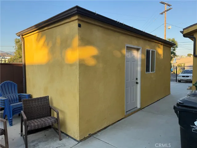 Garage front house from the side. Has an access door on the side.