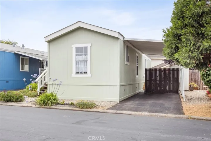 Newer asphalt driveway with moveable fence. Park two cars tandem or use the back of the driveway for a private outdoor space.