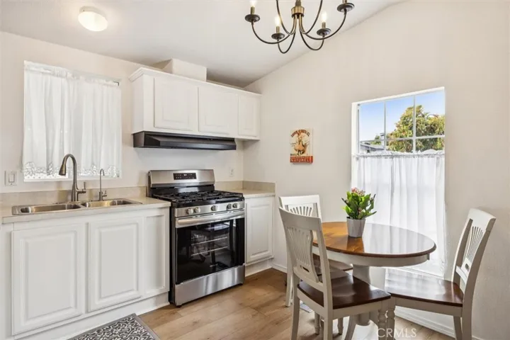 The kitchen has a newer range, refrigerator and a microwave.
