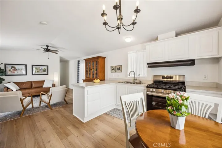 Notice the lovely chandelier and ceiling fan.