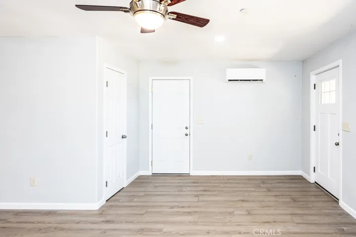 Entry, coat closet, garage door and mini split.